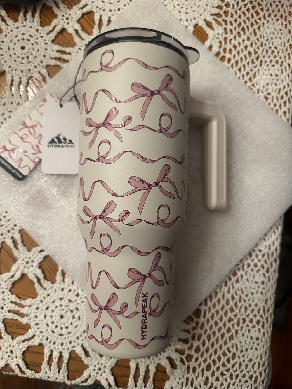 HydraPeak product cream tumbler with pink bows